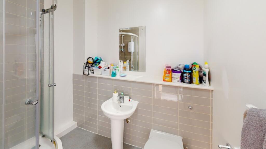 A well-maintained bathroom featuring modern fix...