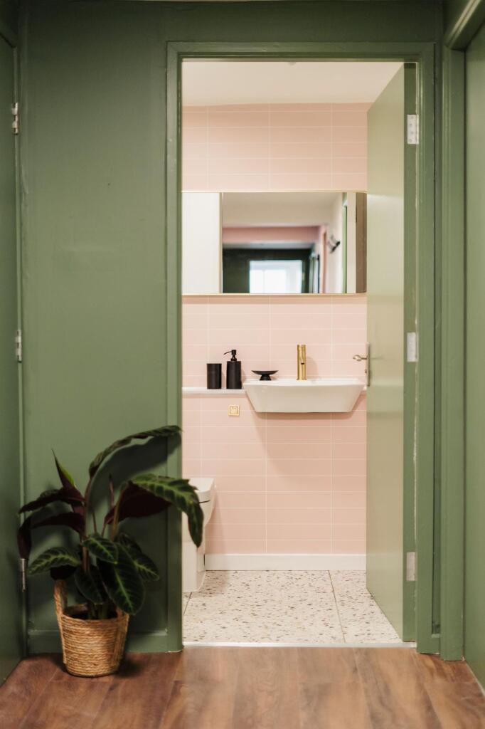 Bright and clean bathroom with a modern sink, w...