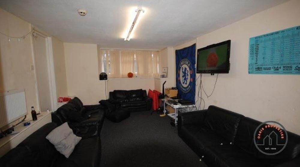 A spacious, modern living room with ample seati...
