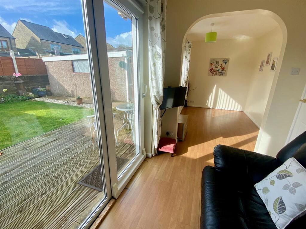 sitting room through to bedroom open plan.jpg