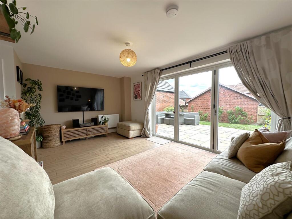 Sizeable Living Room Onto Patio 780