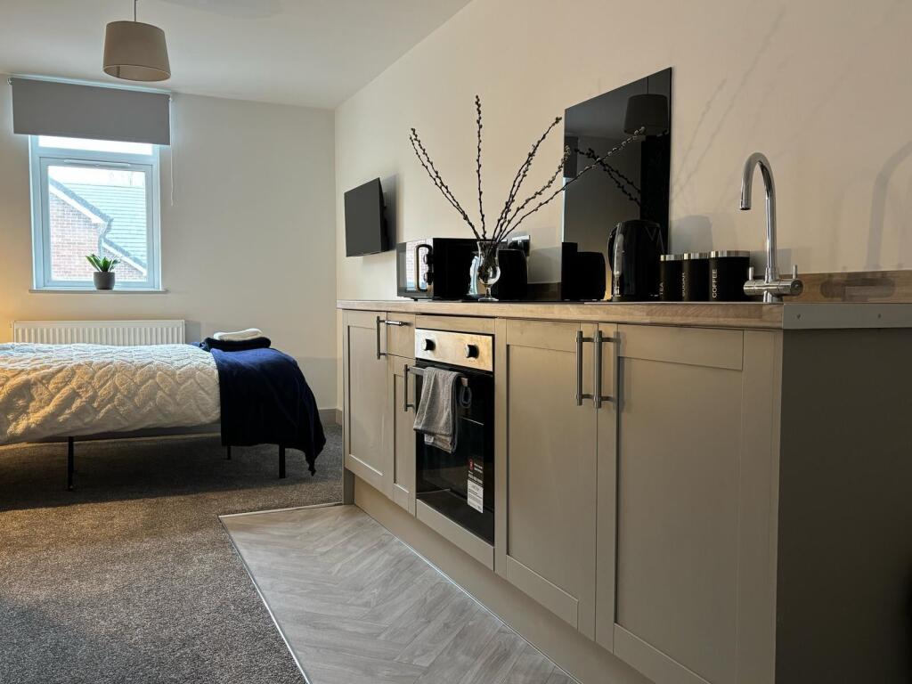 A beautifully designed double bedroom featuring...