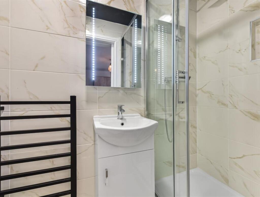 Modern bathroom featuring a sleek sink with a m...