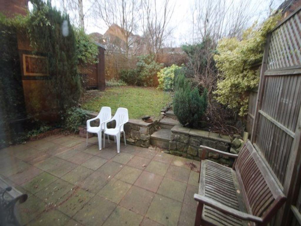 Private rear garden with paved patio, raised la...