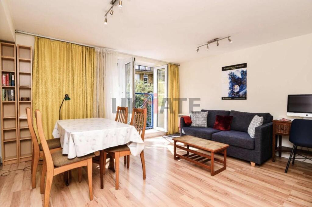 Bright and welcoming living room featuring a co...