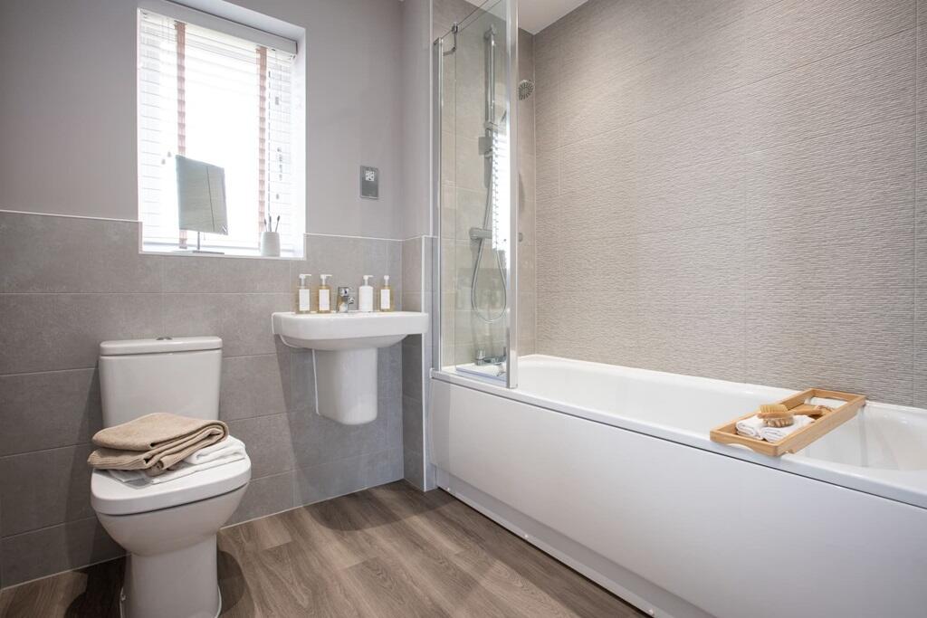 Main bathroom with shower over the bath