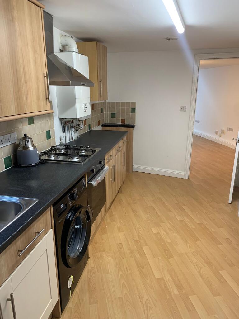 A well-maintained kitchen featuring modern appl...