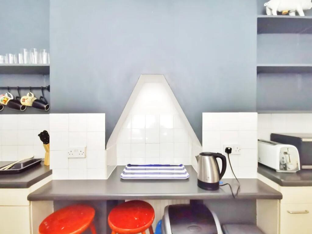 Bright and tidy kitchen area featuring a modern...
