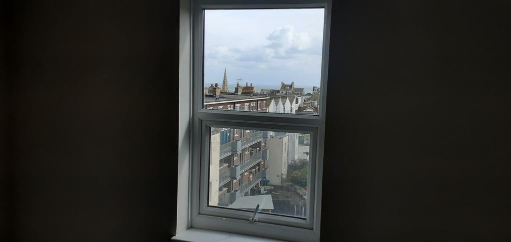 Bedroom window with sea glimpses