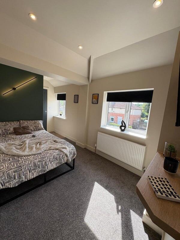 Bright and modern double bedroom featuring a pa...