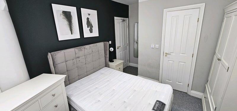 A modern, well-maintained double bedroom featur...