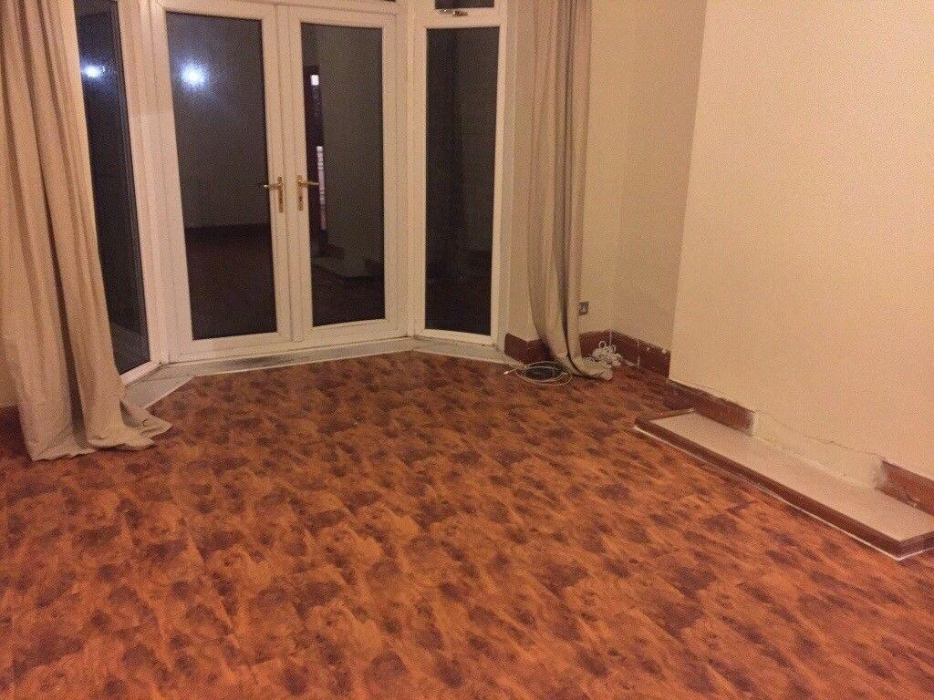 Bright living room with full-height patio doors...