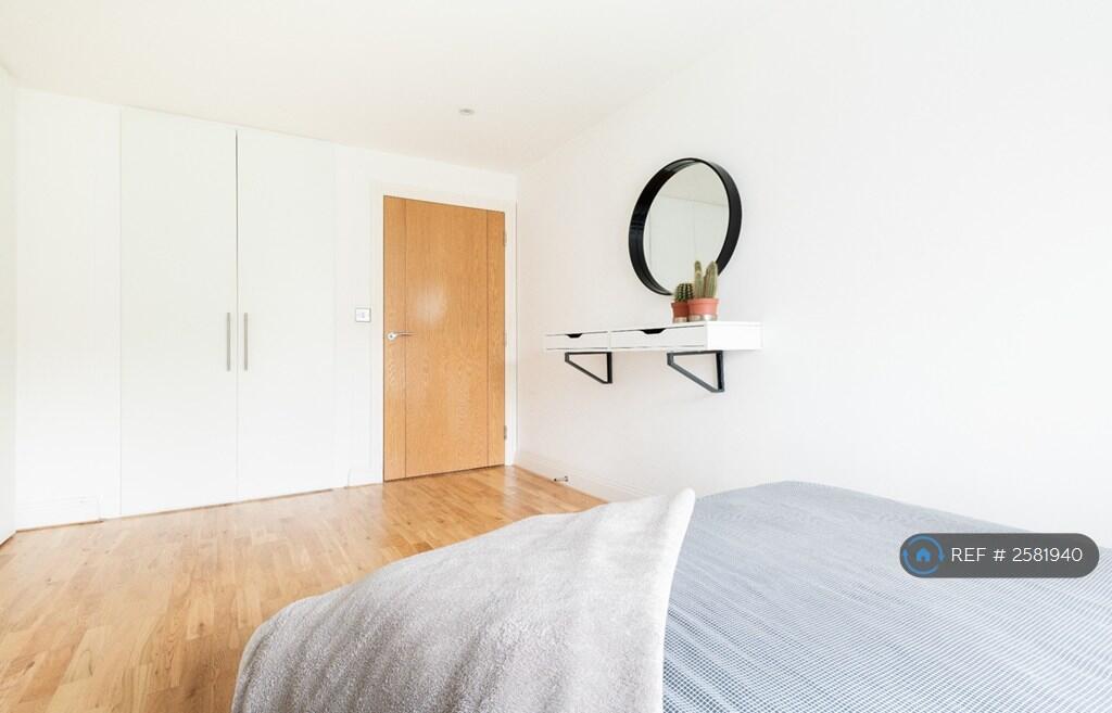 Large Bedroom With a Spacious Built-In Wardrobe