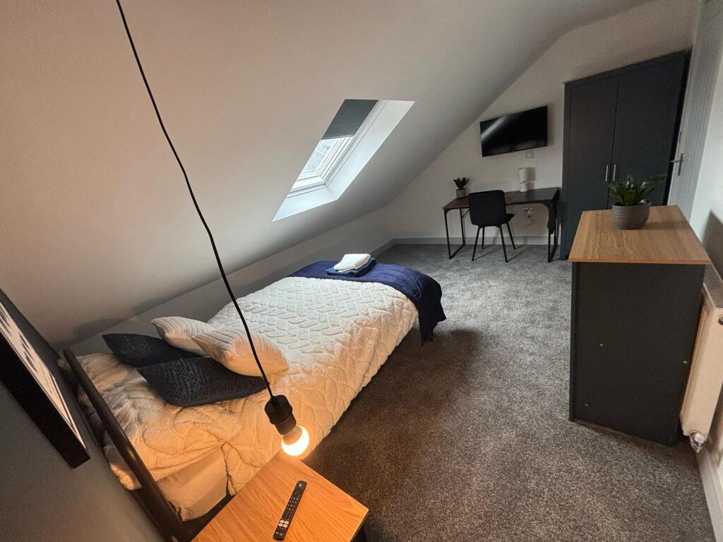 Charming double bedroom featuring a cozy layout...