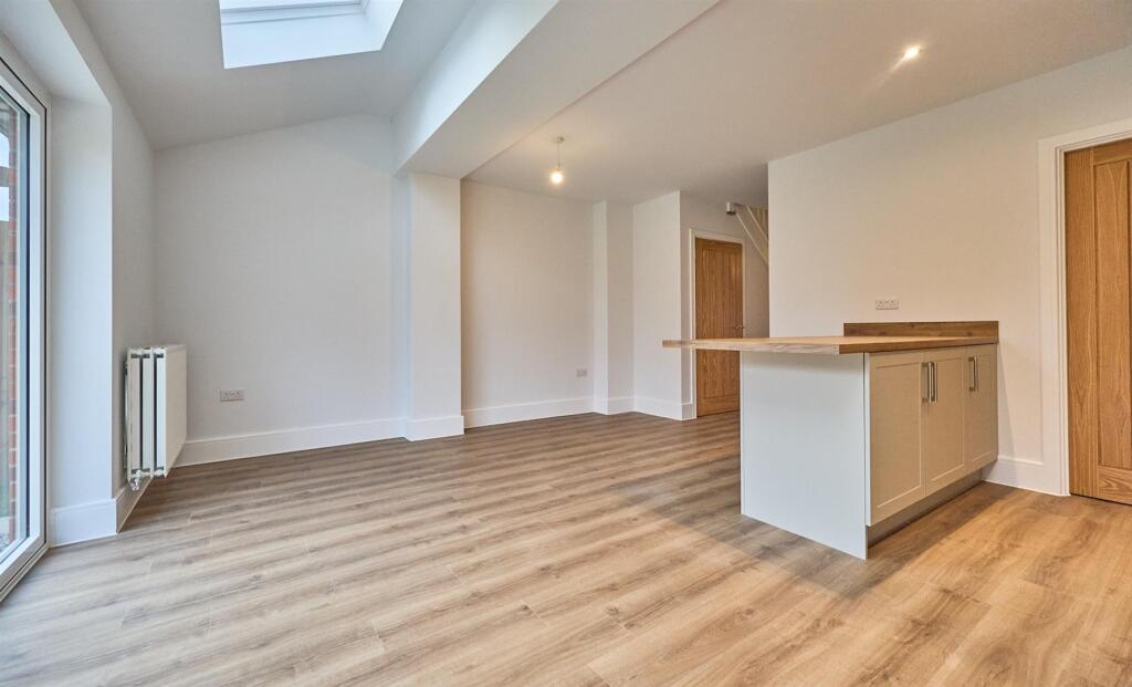 Open plan kitchen diner to rear