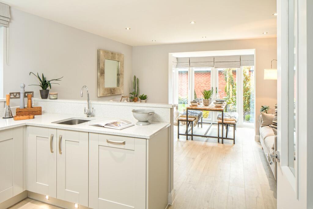 Kitchen with dining area in the Greenwood 3 bedroom home