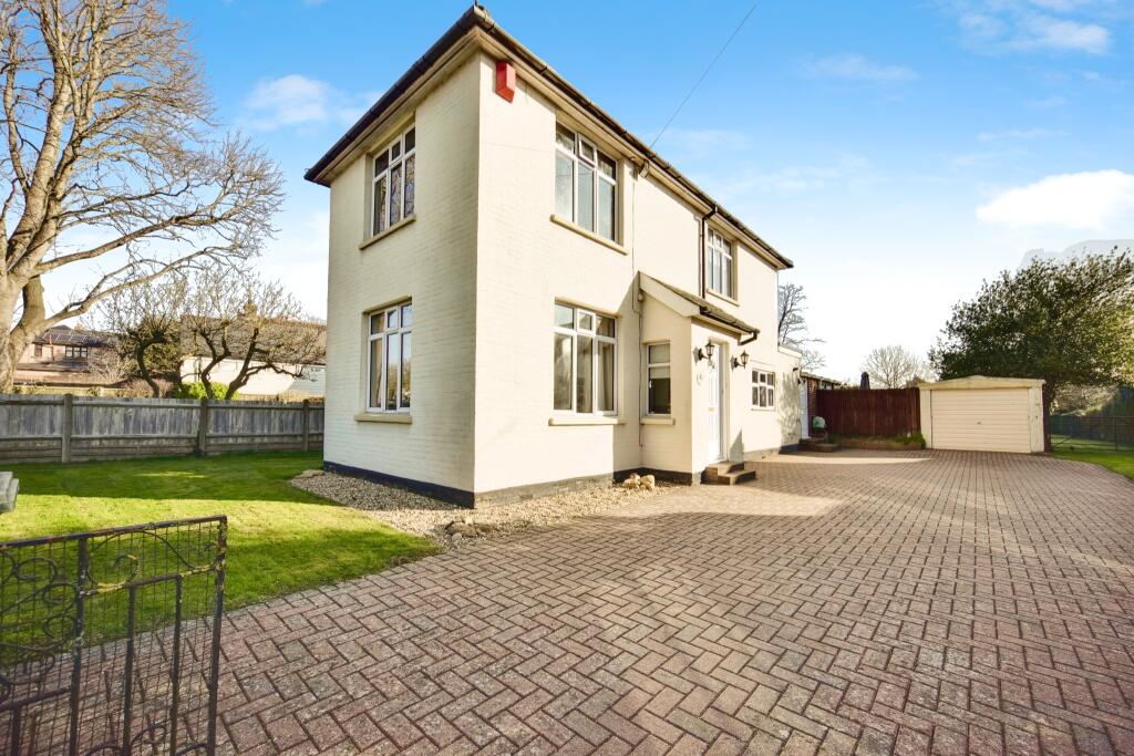 Outside View Of The Property With Driveway Parking