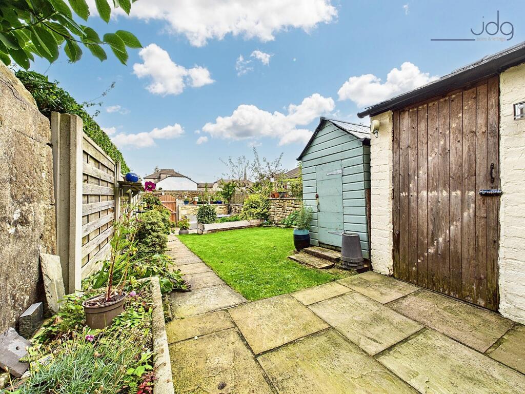 Back garden with storage sheds