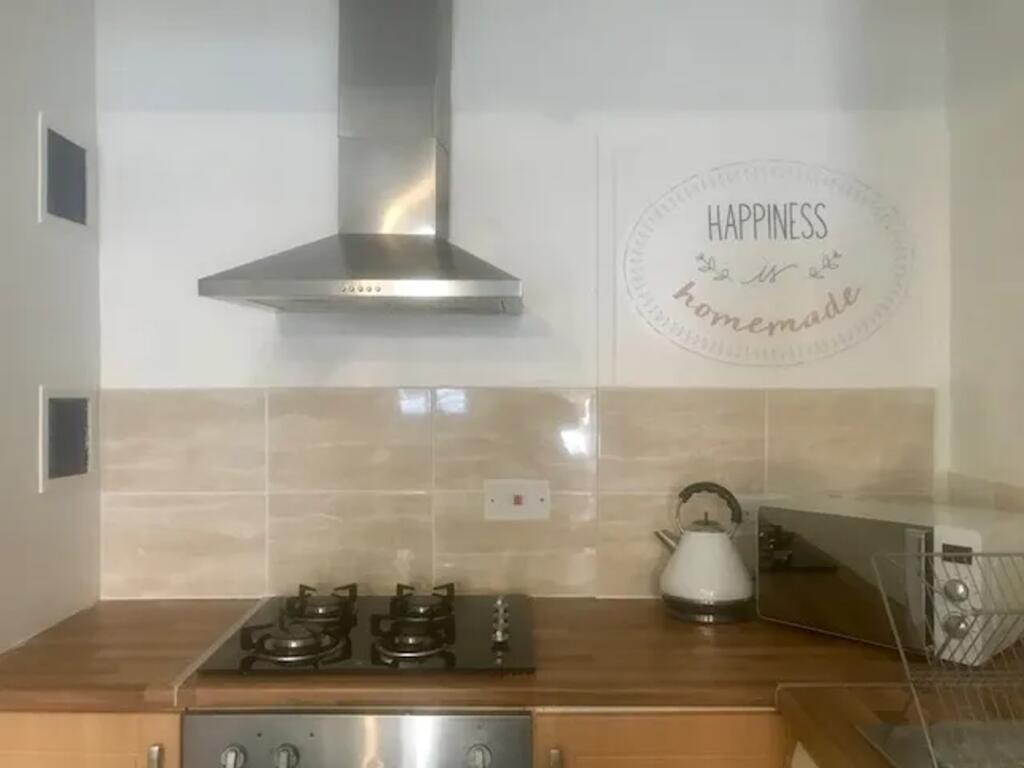 A bright and tidy kitchenette featuring modern ...