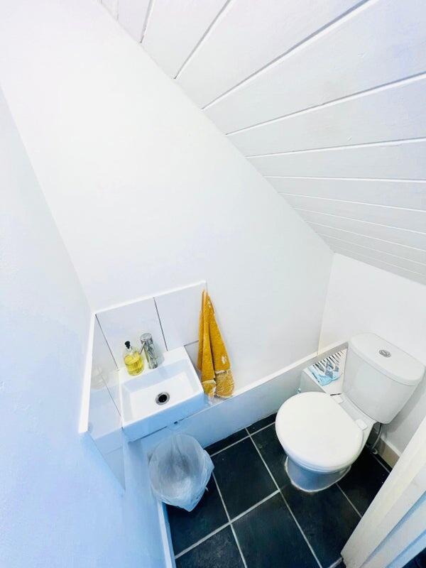 A clean and well-maintained compact toilet room...