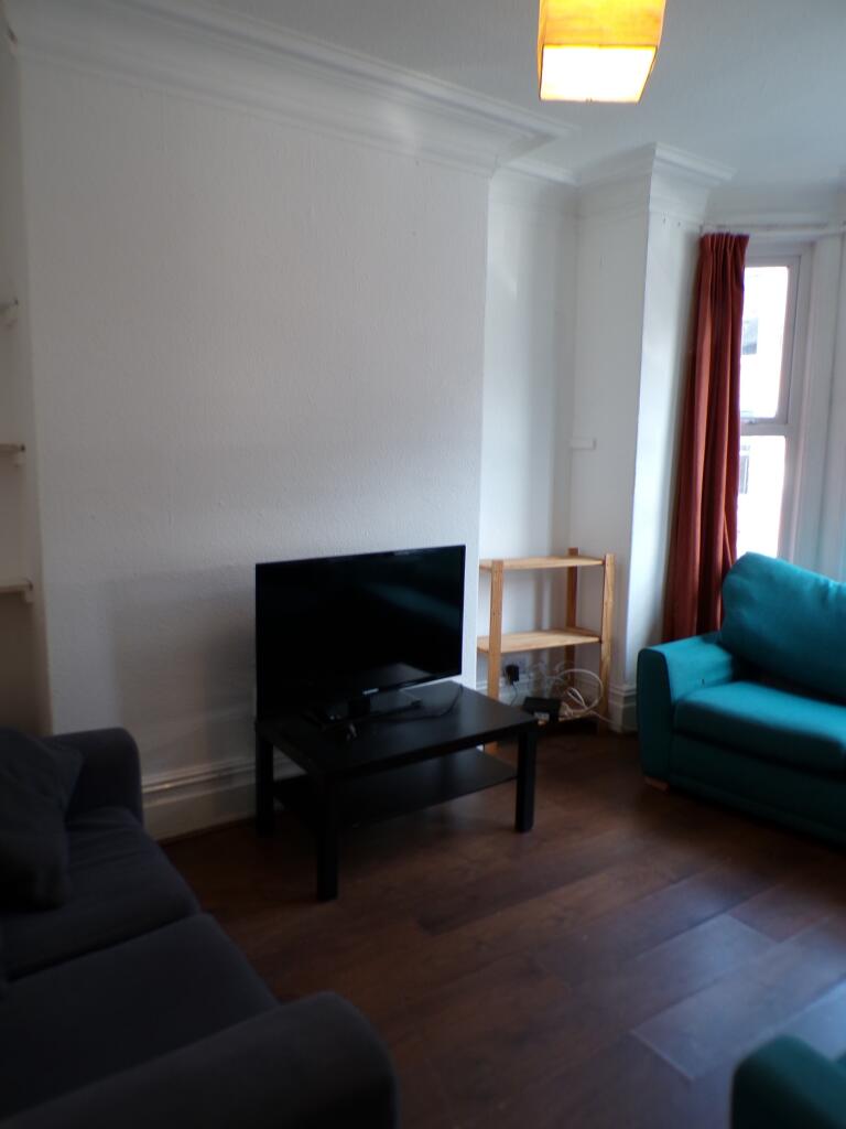 A spacious and inviting large modern living roo...