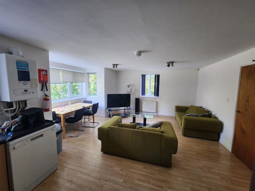 Spacious and bright living room featuring moder...