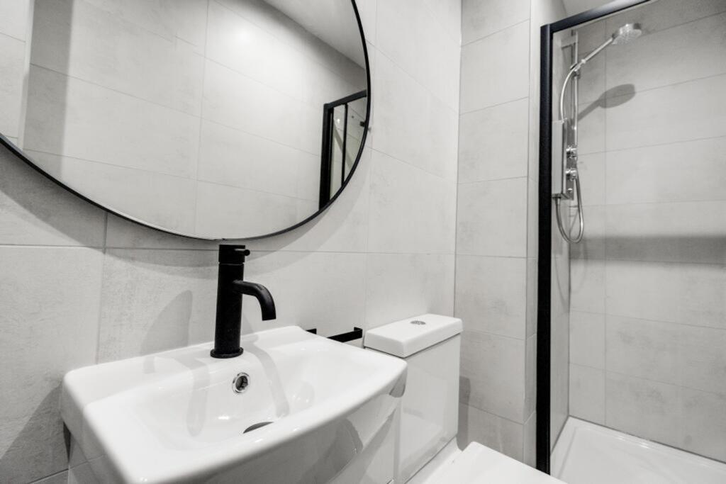 A modern and stylish bathroom featuring a sleek...