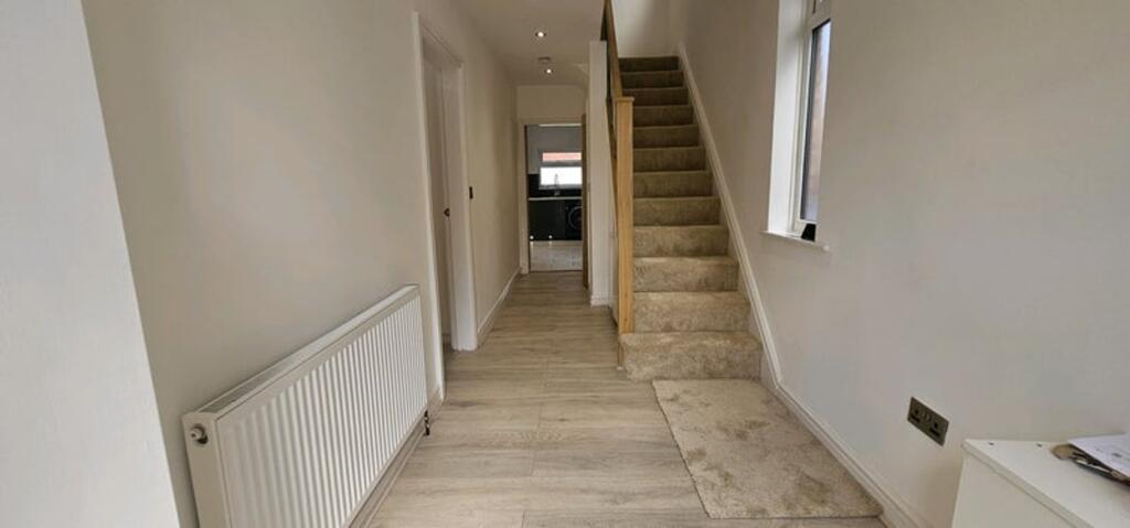 A well-maintained hallway featuring modern deco...