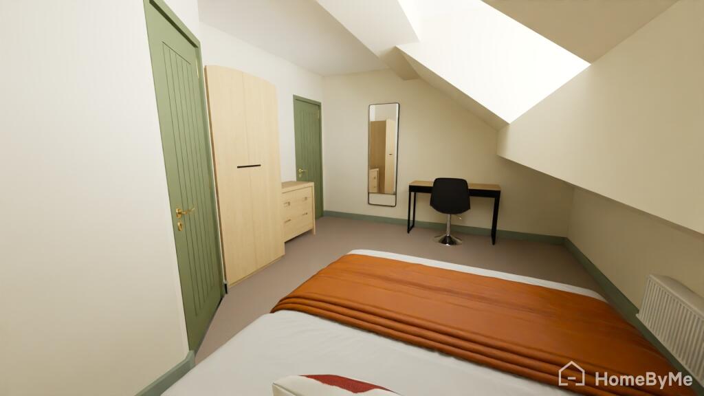A well-maintained bedroom with a comfortable be...