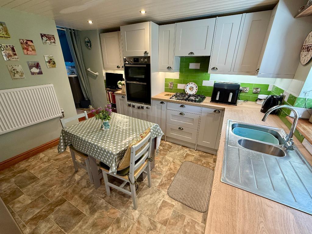 Country kitchen, through to utility area