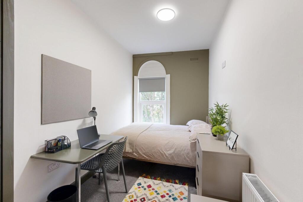 A bright and well-maintained spacious bedroom f...