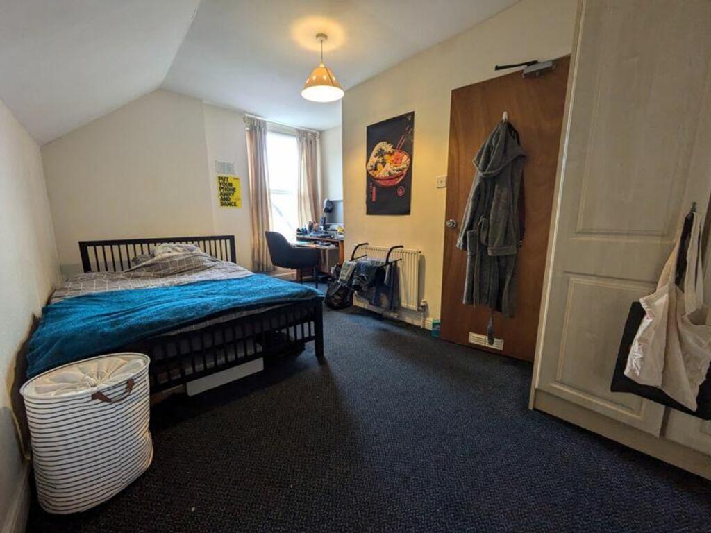A spacious and well-lit double bedroom perfect ...