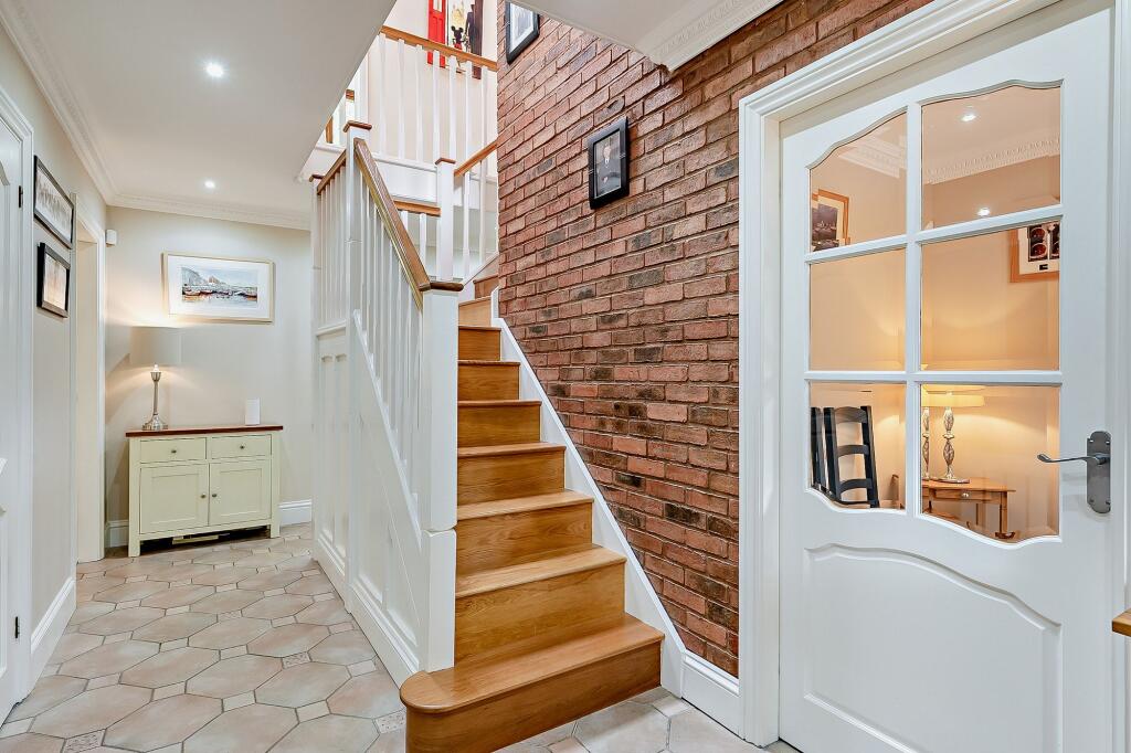 Hallway with feature exposed brick wall