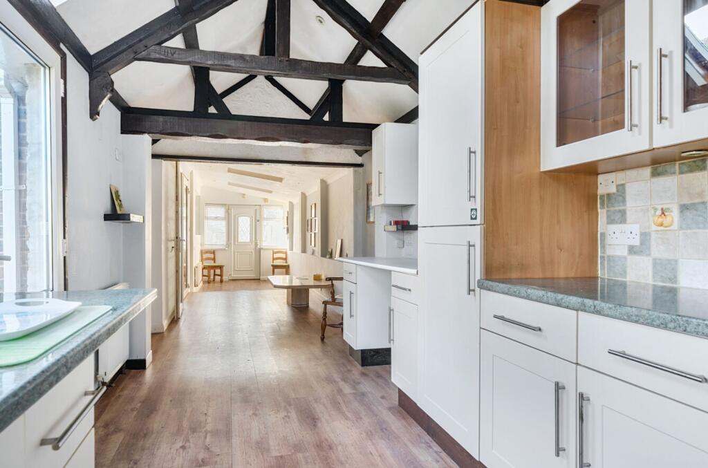 Living/dining area with kitchen/utility area
