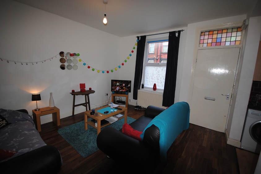 A cozy and well-maintained living room with a c...