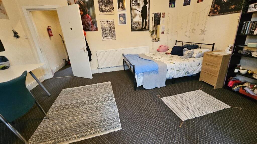 Bright and inviting double bedroom featuring a ...