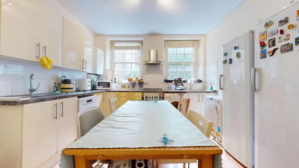 Bright and functional kitchen with ample counte...