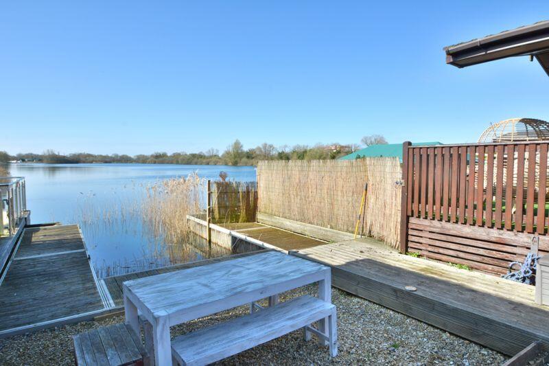 Sitting by the dock of the lake