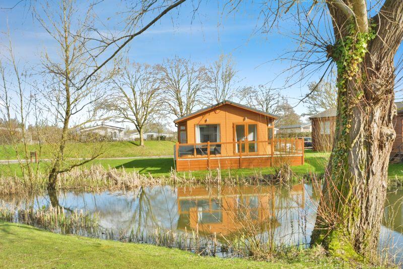 View of property across the lake