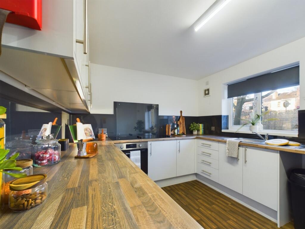 A modern and spacious kitchen with ample natura...