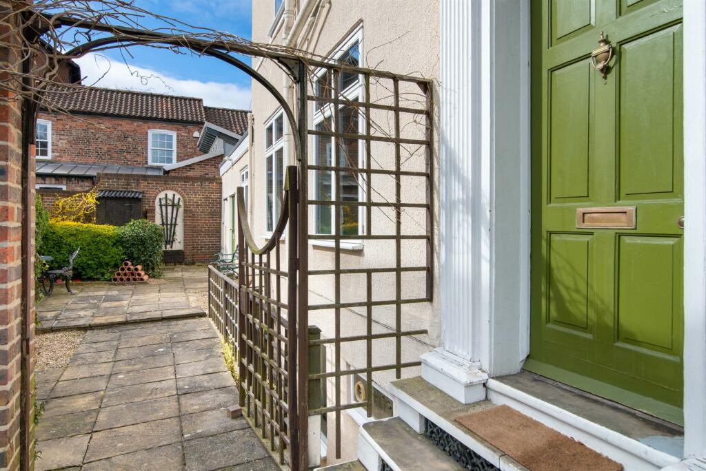 Front door and walled garden