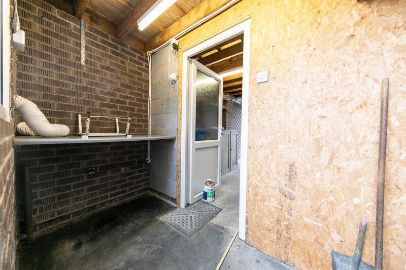 Utilities area to rear of garage