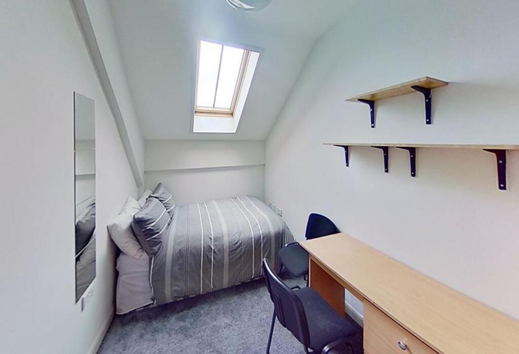Bright and cozy double bedroom featuring a comf...