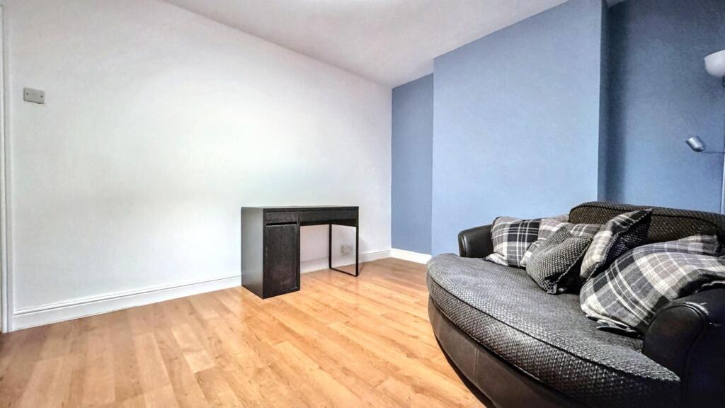 A bright and inviting living room with modern d...
