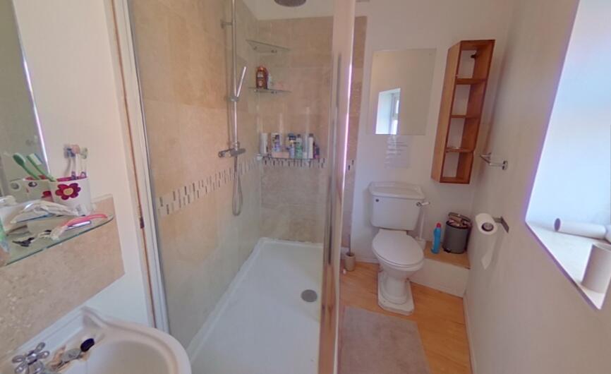 Bright and clean bathroom featuring a spacious ...