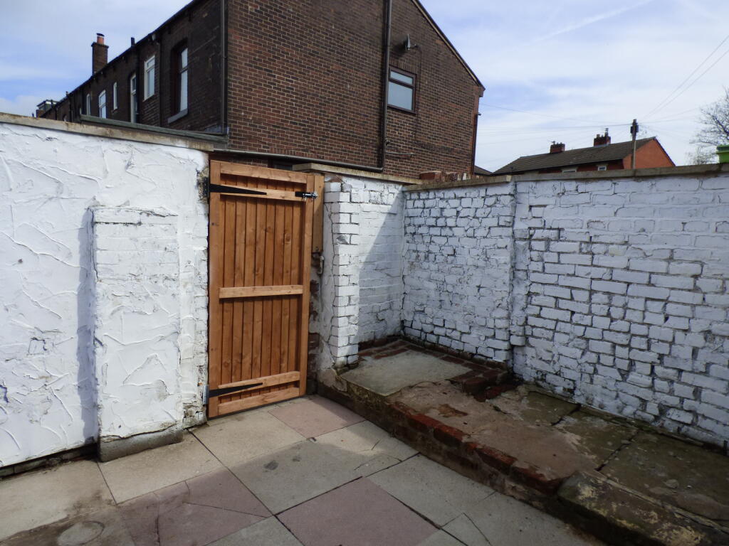 Enclosed rear yard.