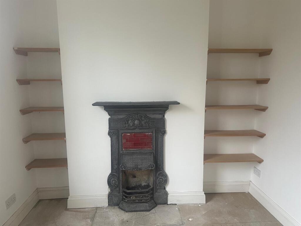 Feature fireplace and shelves.jpg