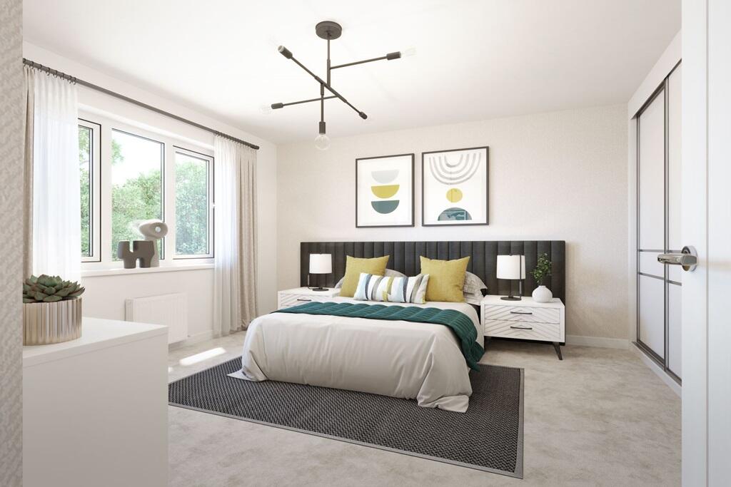 A generously sized double bedroom with storage space