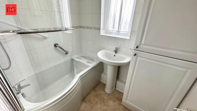 Bright and clean bathroom featuring a modern wh...