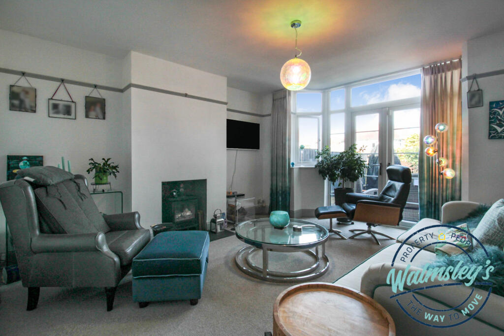 Rear sitting room with French doors to garden